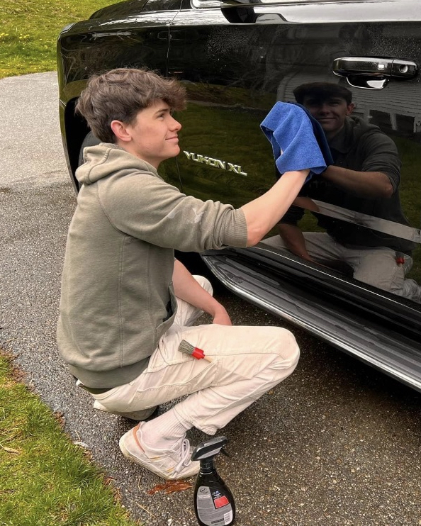 Refresh Mobile Detailing hand-detailing a customer vehicle